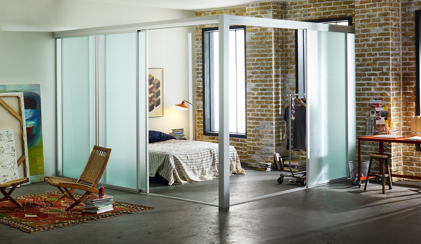 How it is beneficial to partition space with a glass wall?